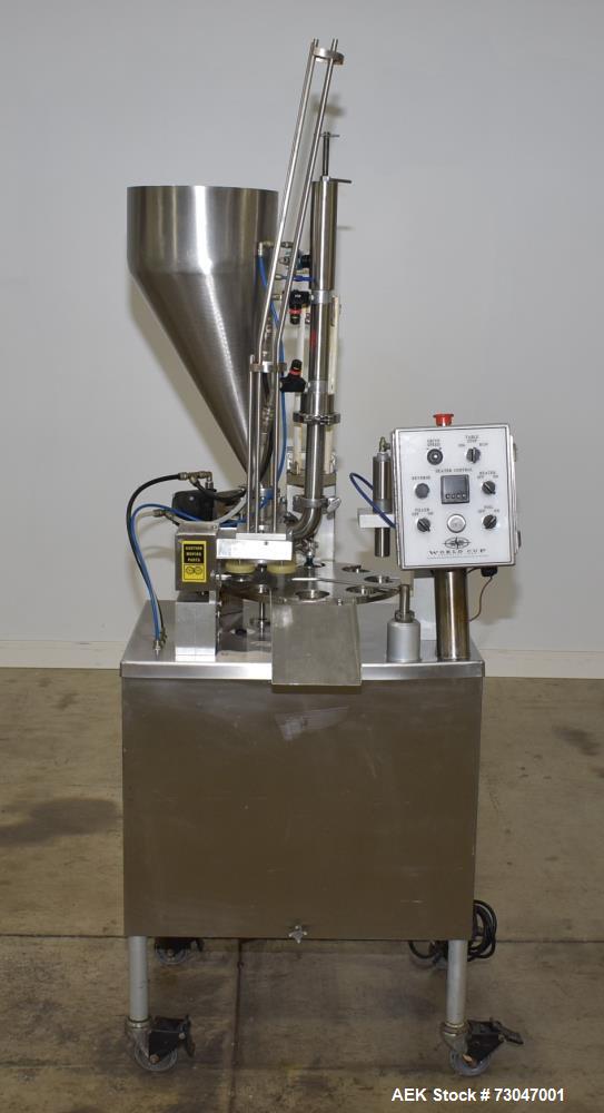 Used- World Cup Rotary Cup Filling Machine, Model #8-12. 8 Stations. Hopper capacity 2.5 Gallons, 11.25" diameter. Originall...