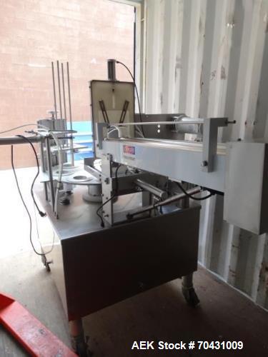 Used World Cup Packaging 8-80 Cup Filler. Container size: up to 80 ounces or up to 6.5 inch maximum diameter with change parts from the OEM. Filling speed: up to 40 indexes per minute depending on cu...