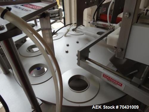 Used World Cup Packaging 8-80 Cup Filler. Container size: up to 80 ounces or up to 6.5 inch maximum diameter with change parts from the OEM. Filling speed: up to 40 indexes per minute depending on cu...