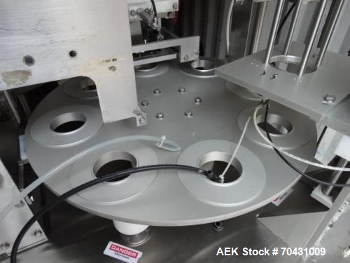 Used World Cup Packaging 8-80 Cup Filler. Container size: up to 80 ounces or up to 6.5 inch maximum diameter with change parts from the OEM. Filling speed: up to 40 indexes per minute depending on cu...