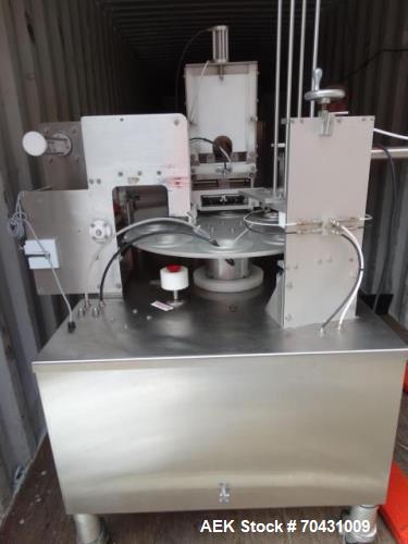 Used World Cup Packaging 8-80 Cup Filler. Container size: up to 80 ounces or up to 6.5 inch maximum diameter with change parts from the OEM. Filling speed: up to 40 indexes per minute depending on cu...