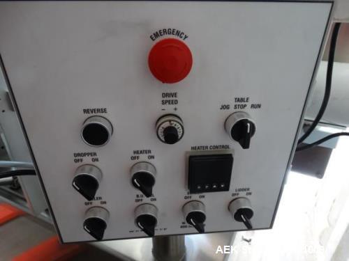 Used World Cup Packaging 8-80 Cup Filler. Container size: up to 80 ounces or up to 6.5 inch maximum diameter with change parts from the OEM. Filling speed: up to 40 indexes per minute depending on cu...
