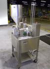 Used Autoprod (Oystar) Model 2000 Fil-N-Seal Rotary Cup Filler and Heat Sealer. Filler for thin liquids only water like product. Capable of speeds up to 60 cpm. Cup size range: diameter 1