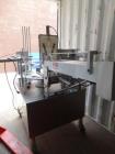 Used World Cup Packaging 8-80 Cup Filler. Container size: up to 80 ounces or up to 6.5 inch maximum diameter with change parts from the OEM. Filling speed: up to 40 indexes per minute depending on cu...
