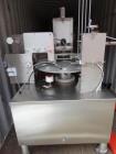 Used World Cup Packaging 8-80 Cup Filler. Container size: up to 80 ounces or up to 6.5 inch maximum diameter with change parts from the OEM. Filling speed: up to 40 indexes per minute depending on cu...