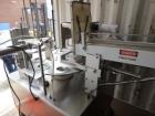 Used World Cup Packaging 8-80 Cup Filler. Container size: up to 80 ounces or up to 6.5 inch maximum diameter with change parts from the OEM. Filling speed: up to 40 indexes per minute depending on cu...