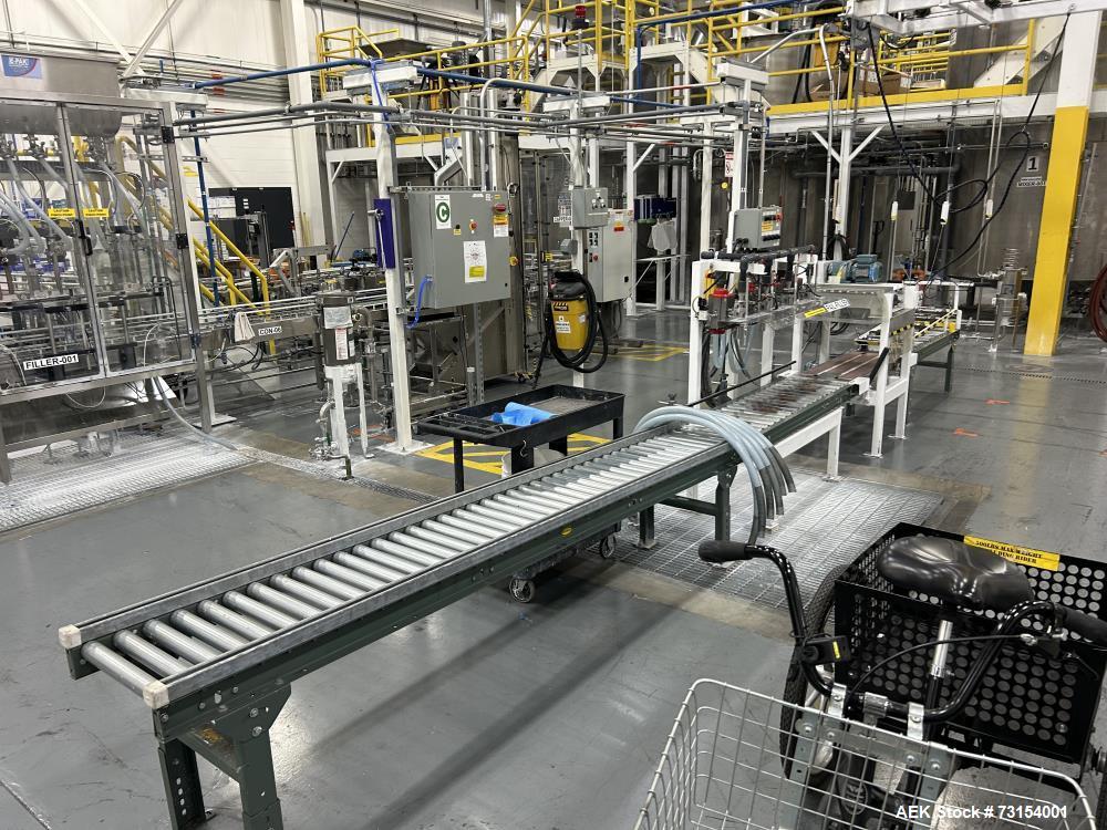 Used Complete 5 Gallon Pail Filling Line with Filler and Lidder. Filler is a 4 head unit with manual lid plcement and automatic lid sealing station. Includes interconnecting roller conveyor.