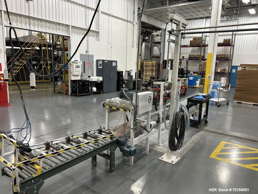 Used Complete 5 Gallon Pail Filling Line with Filler and Lidder. Filler is a 4 head unit with manual lid plcement and automatic lid sealing station. Includes interconnecting roller conveyor.
