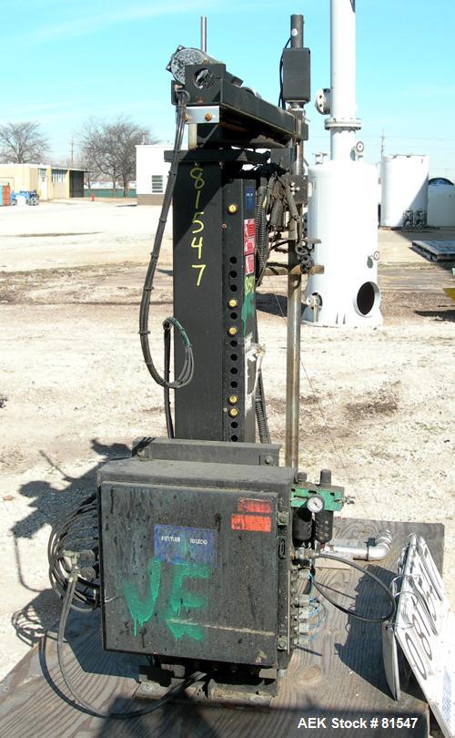 Used Mettler Toledo XP drum filling system consisting of: (1) Mettler model 9127 drum filler, approximate 2" diameter x 36" long stainless steel filling tube, (1) 50" wide x 5' long powered roller co...