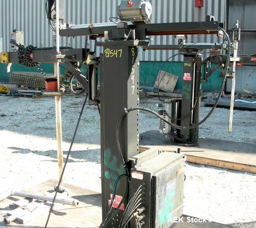 Used Mettler Toledo XP drum filling system consisting of: (1) Mettler model 9127 drum filler, approximate 2" diameter x 36" long stainless steel filling tube, (1) 50" wide x 5' long powered roller co...