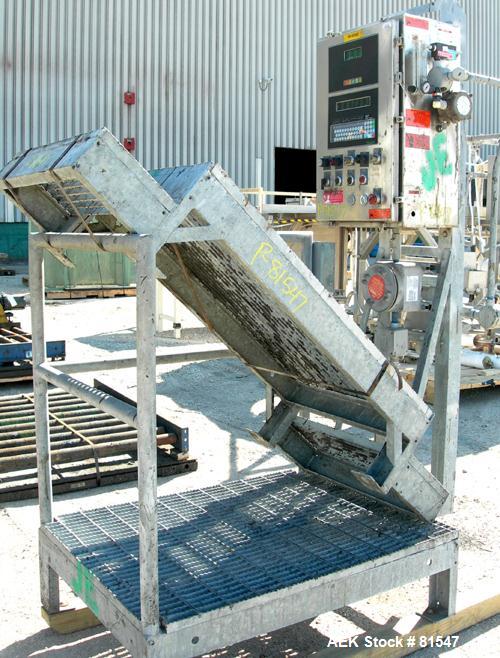 Used Mettler Toledo XP drum filling system consisting of: (1) Mettler model 9127 drum filler, approximate 2" diameter x 36" long stainless steel filling tube, (1) 50" wide x 5' long powered roller co...