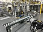 Used Complete 5 Gallon Pail Filling Line with Filler and Lidder. Filler is a 4 head unit with manual lid plcement and automatic lid sealing station. Includes interconnecting roller conveyor.