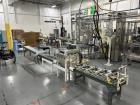 Used Complete 5 Gallon Pail Filling Line with Filler and Lidder. Filler is a 4 head unit with manual lid plcement and automatic lid sealing station. Includes interconnecting roller conveyor.