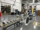 Used Complete 5 Gallon Pail Filling Line with Filler and Lidder. Filler is a 4 head unit with manual lid plcement and automatic lid sealing station. Includes interconnecting roller conveyor.