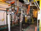 Used-Toledo scale two line drum filling line with individual automatic load cell controlled filling nozzles, drum feed is au...