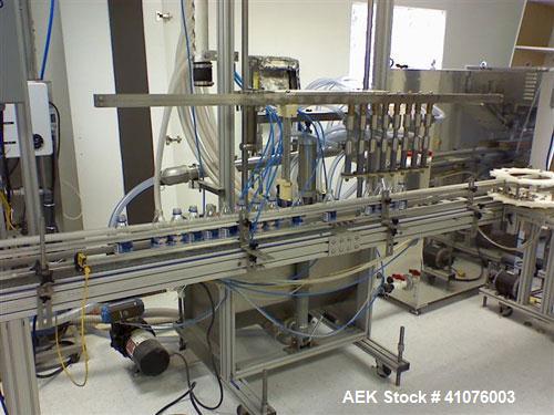 Used Equipment Express 8 Head Gravity Overflow Filler. Stainless Steel With Conveyor & Recirculation Pump