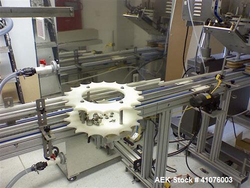 Used Equipment Express 8 Head Gravity Overflow Filler. Stainless Steel With Conveyor & Recirculation Pump