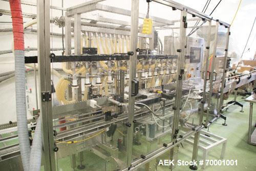 Used Epak 16 Head Inline Gravity Overflow Filler. It has 16 3/4" diameter fill nozzles. Star wheel indexing, bottom up fill, drip tray. With PLC controls and 10' long stainless steel conveyor.
