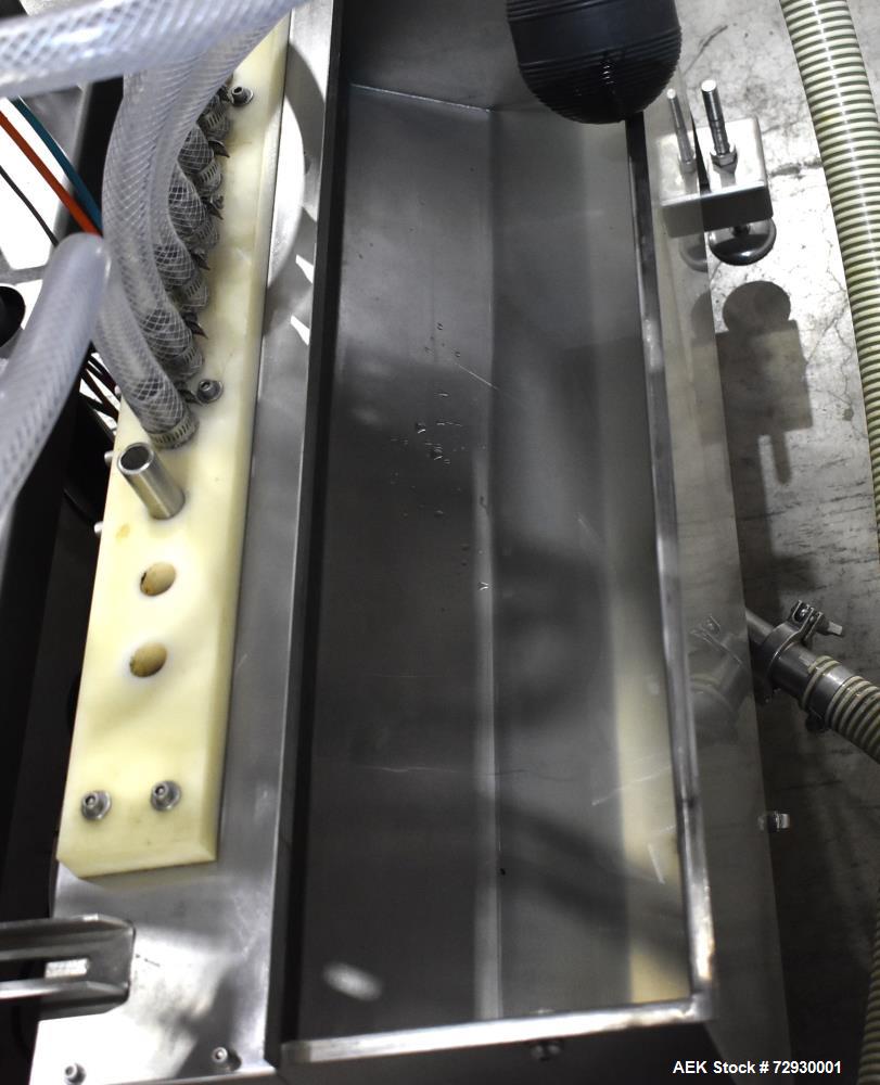 Used Accutek APOF Series Automatic Pressure 6 Head Overflow Filler, Model APOF-6. (6) Stainless steel nozzles, 4.5" x 5/8" diameter. Filling speed of up to 60 CPM. Viscosity range of 2,000 cps (Centi...