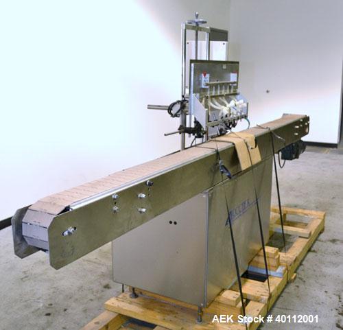 Used Accutek Auto Pinch 25 Automatic 6 Head Timed Flow Volumetric Filling Machine. Capable of speeds up to 60 BPM. Has pneumatic cylinder pin indexing, heavy duty design, 10' long 4-1/2"wide delrin T...