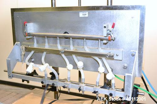 Used Accutek Auto Pinch 25 Automatic 6 Head Timed Flow Volumetric Filling Machine. Capable of speeds up to 60 BPM. Has pneumatic cylinder pin indexing, heavy duty design, 10' long 4-1/2"wide delrin T...