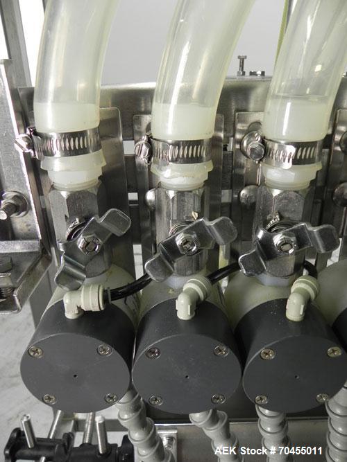 Used ELF (E-PAK) Model 15 CONV 12 Head Inline Time Gravity Pressure Liquid Filler. Capable of speeds over 100 bottles per minute. Has pin indexing system. Neck pneumatic guides. Has a machine mounted...