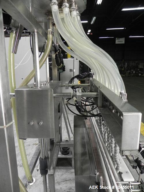 Used ELF (E-PAK) Model 15 CONV 12 Head Inline Time Gravity Pressure Liquid Filler. Capable of speeds over 100 bottles per minute. Has pin indexing system. Neck pneumatic guides. Has a machine mounted...