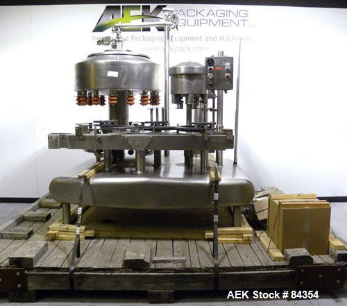 Used Federal Rotary Gravity Filler, Model GWS3/155R1092, 304 Stainless Steel. (15) 1" diameter nozzles on approximate 7-1/2" centers. Set up with a 5 head press-on rotary capper (requires sorter and ...