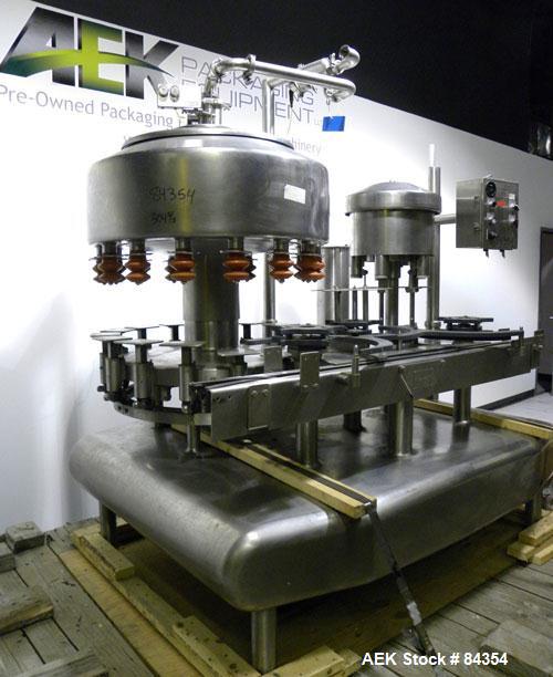 Used Federal Rotary Gravity Filler, Model GWS3/155R1092, 304 Stainless Steel. (15) 1" diameter nozzles on approximate 7-1/2" centers. Set up with a 5 head press-on rotary capper (requires sorter and ...