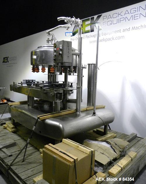 Used Federal Rotary Gravity Filler, Model GWS3/155R1092, 304 Stainless Steel. (15) 1" diameter nozzles on approximate 7-1/2" centers. Set up with a 5 head press-on rotary capper (requires sorter and ...