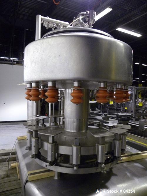 Used Federal Rotary Gravity Filler, Model GWS3/155R1092, 304 Stainless Steel. (15) 1" diameter nozzles on approximate 7-1/2" centers. Set up with a 5 head press-on rotary capper (requires sorter and ...