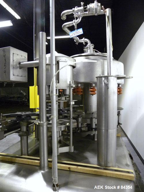 Used Federal Rotary Gravity Filler, Model GWS3/155R1092, 304 Stainless Steel. (15) 1" diameter nozzles on approximate 7-1/2" centers. Set up with a 5 head press-on rotary capper (requires sorter and ...