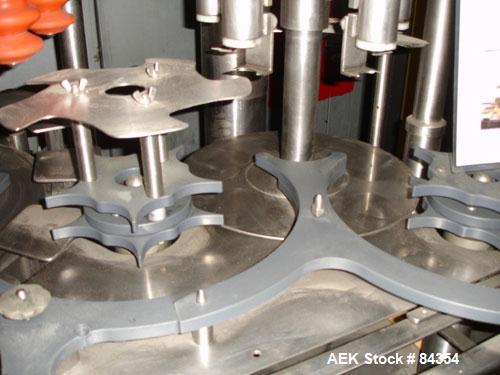 Used Federal Rotary Gravity Filler, Model GWS3/155R1092, 304 Stainless Steel. (15) 1" diameter nozzles on approximate 7-1/2" centers. Set up with a 5 head press-on rotary capper (requires sorter and ...