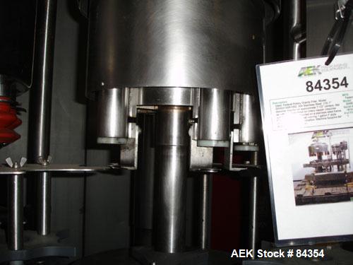 Used Federal Rotary Gravity Filler, Model GWS3/155R1092, 304 Stainless Steel. (15) 1" diameter nozzles on approximate 7-1/2" centers. Set up with a 5 head press-on rotary capper (requires sorter and ...