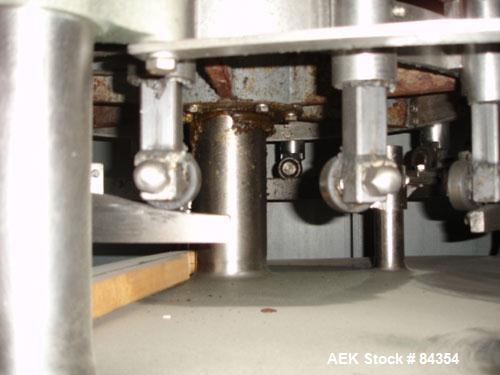 Used Federal Rotary Gravity Filler, Model GWS3/155R1092, 304 Stainless Steel. (15) 1" diameter nozzles on approximate 7-1/2" centers. Set up with a 5 head press-on rotary capper (requires sorter and ...