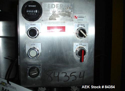 Used Federal Rotary Gravity Filler, Model GWS3/155R1092, 304 Stainless Steel. (15) 1" diameter nozzles on approximate 7-1/2" centers. Set up with a 5 head press-on rotary capper (requires sorter and ...