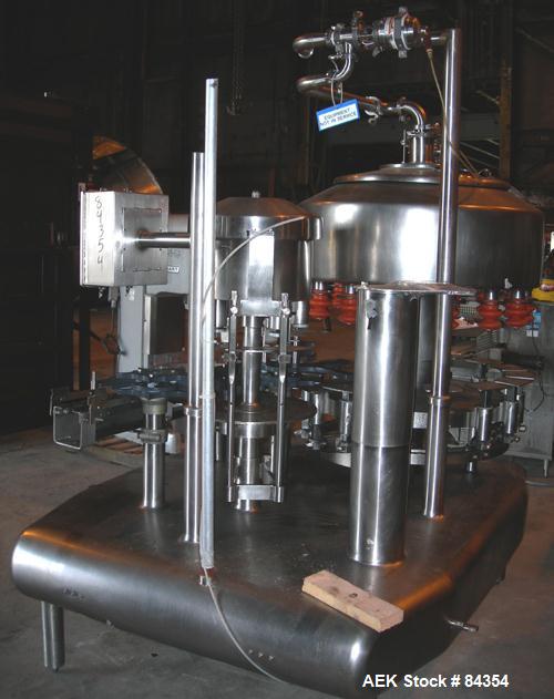 Used Federal Rotary Gravity Filler, Model GWS3/155R1092, 304 Stainless Steel. (15) 1" diameter nozzles on approximate 7-1/2" centers. Set up with a 5 head press-on rotary capper (requires sorter and ...