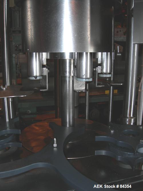 Used Federal Rotary Gravity Filler, Model GWS3/155R1092, 304 Stainless Steel. (15) 1" diameter nozzles on approximate 7-1/2" centers. Set up with a 5 head press-on rotary capper (requires sorter and ...