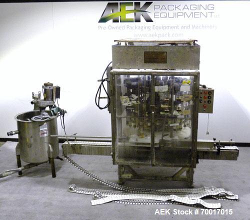 Used Filling Equipment Company 24 Head Rotary Overflow Filler, Model 9345122. Unit has 1/2" diameter nozzles on 5-1/4" centers. Contact parts 316 stainless steel. Frame is 304 stainless steel. Right ...