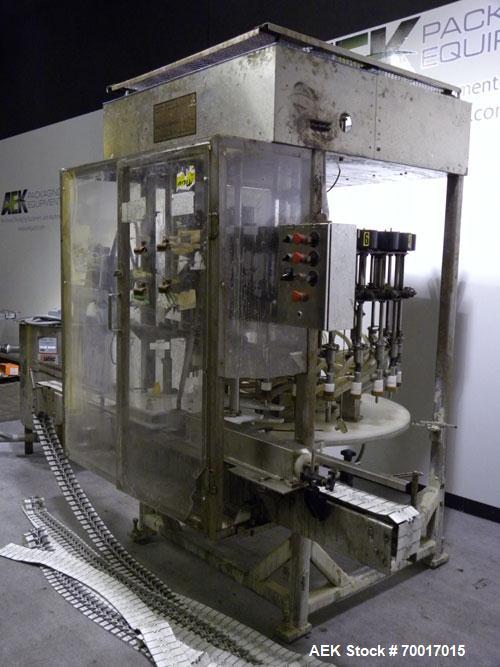 Used Filling Equipment Company 24 Head Rotary Overflow Filler, Model 9345122. Unit has 1/2" diameter nozzles on 5-1/4" centers. Contact parts 316 stainless steel. Frame is 304 stainless steel. Right ...