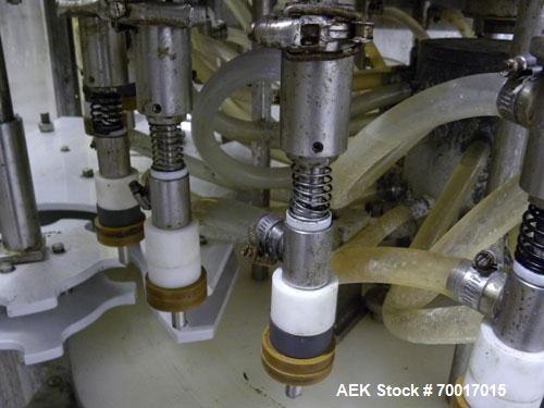Used Filling Equipment Company 24 Head Rotary Overflow Filler, Model 9345122. Unit has 1/2" diameter nozzles on 5-1/4" centers. Contact parts 316 stainless steel. Frame is 304 stainless steel. Right ...