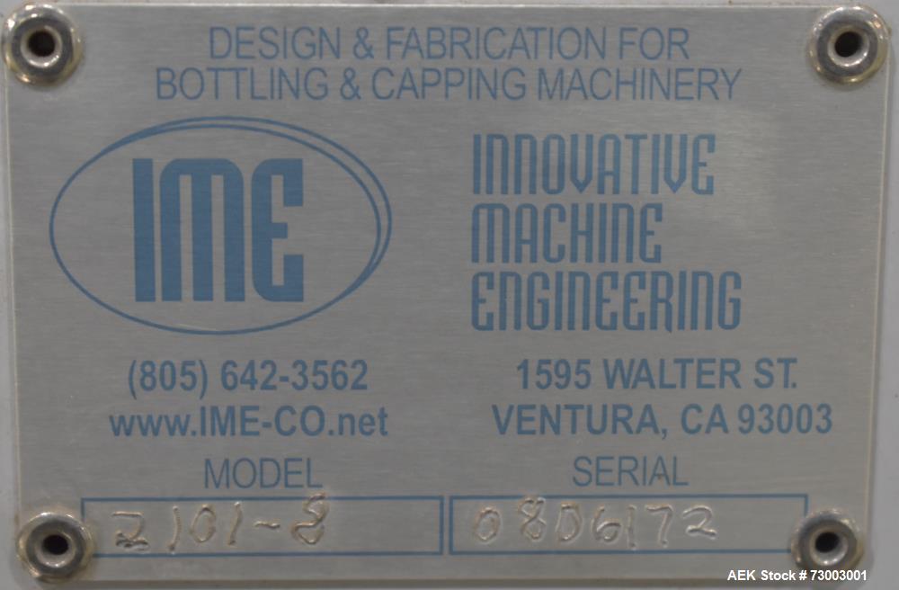 IME Model 2101 8-Head Semi Automatic Inline Pressure Filler.