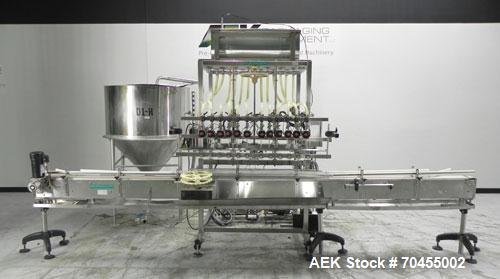 Used Inline Filling Systems 12 head inline time gravity filler. Capable of speeds over 100 bottle per minute. Has star wheel indexing system, neck guides, drip tray, and 12 'long x 4-1/2" wide convey...
