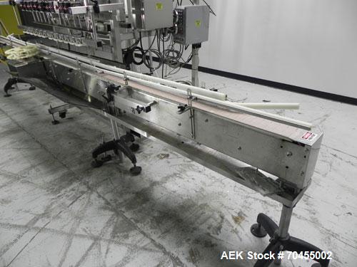Used Inline Filling Systems 12 head inline time gravity filler. Capable of speeds over 100 bottle per minute. Has star wheel indexing system, neck guides, drip tray, and 12 'long x 4-1/2" wide convey...