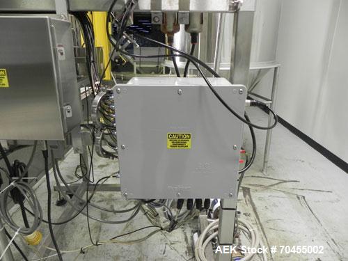 Used Inline Filling Systems 12 head inline time gravity filler. Capable of speeds over 100 bottle per minute. Has star wheel indexing system, neck guides, drip tray, and 12 'long x 4-1/2" wide convey...