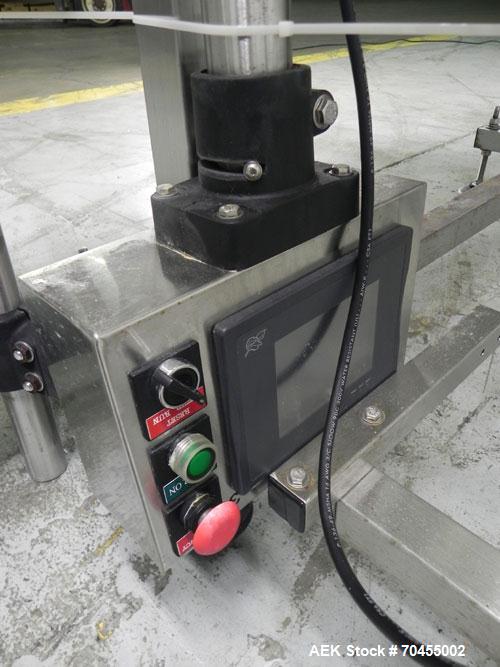 Used Inline Filling Systems 12 head inline time gravity filler. Capable of speeds over 100 bottle per minute. Has star wheel indexing system, neck guides, drip tray, and 12 'long x 4-1/2" wide convey...