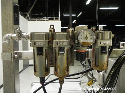 Used Inline Filling Systems 12 head inline time gravity filler. Capable of speeds over 100 bottle per minute. Has star wheel indexing system, neck guides, drip tray, and 12 'long x 4-1/2" wide convey...
