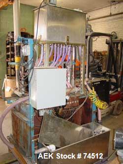 USED: New Way gravity liquid filler, 9 head straight line. Nozzles:(9) 5/8" diameter x 3" long. Stainless steel recirculation tank3' long x 12" wide x 16" deep.