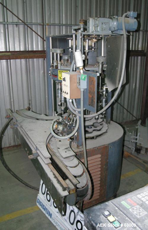 Used- U.S. Bottlers 8 Head Rotary Gravity Fillter. Has 1/2" diameter nozzles which are stainless steel. Nozzles are set on 7...