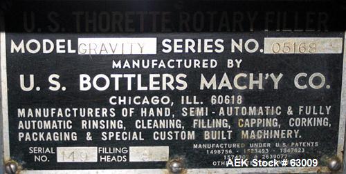 Used- U.S. Bottlers 8 Head Rotary Gravity Fillter. Has 1/2" diameter nozzles which are stainless steel. Nozzles are set on 7...